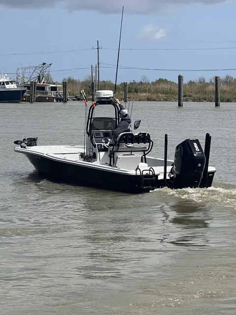 The Southern Delta Charters bay boat idling out of the marina in Venice, Louisiana