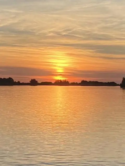 Sun rising over the marsh in the Venice delta