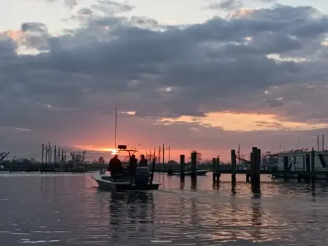 Sunrise over the boat slips at the marina in Venice, Louisiana